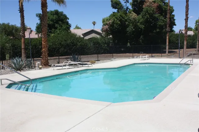 a view of a swimming pool with a patio