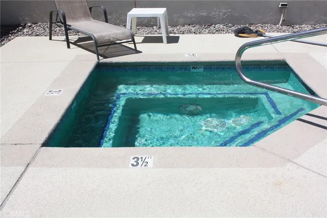 a view of swimming pool from a balcony