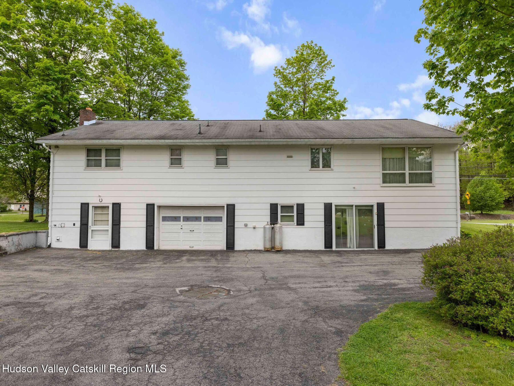 104 New Paltz Road Highland, NY 12528 - Photo 37 of 43 a front view of a house with a yard garage and outdoor seating