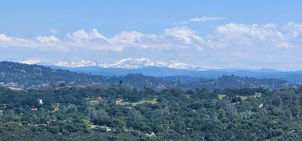 a view of a city and mountains in the background