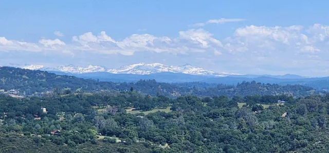 a view of a city and mountains in the background