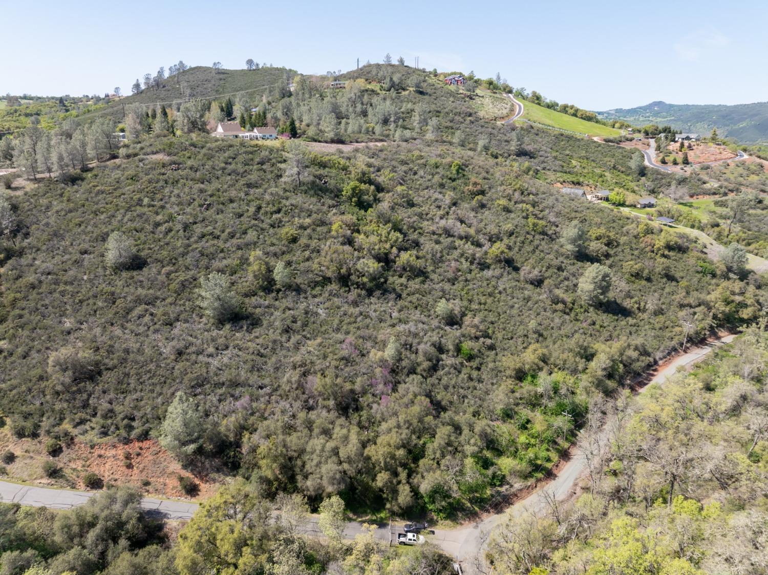 6 Jurgens Road Rescue, CA 95672 - Photo 5 of 24 a view of a dry yard with mountains in the background