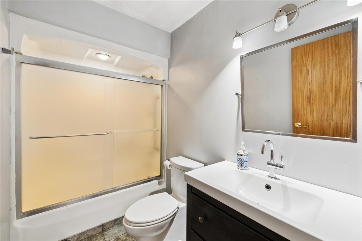 1702 Oak Street St. Charles, IL 60174 - Photo 12 of 20 a bathroom with a sink toilet and shower