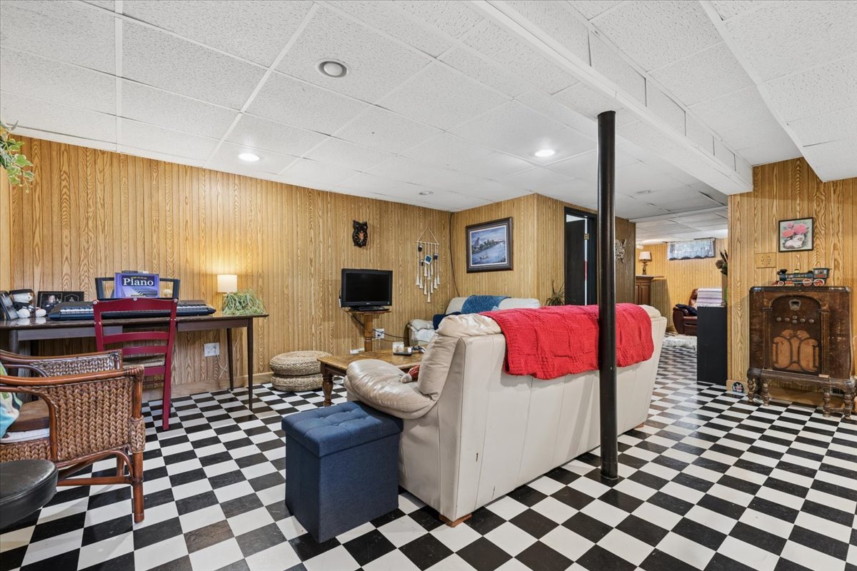 1702 Oak Street St. Charles, IL 60174 - Photo 14 of 20 a living room with furniture a flat screen tv and a fireplace