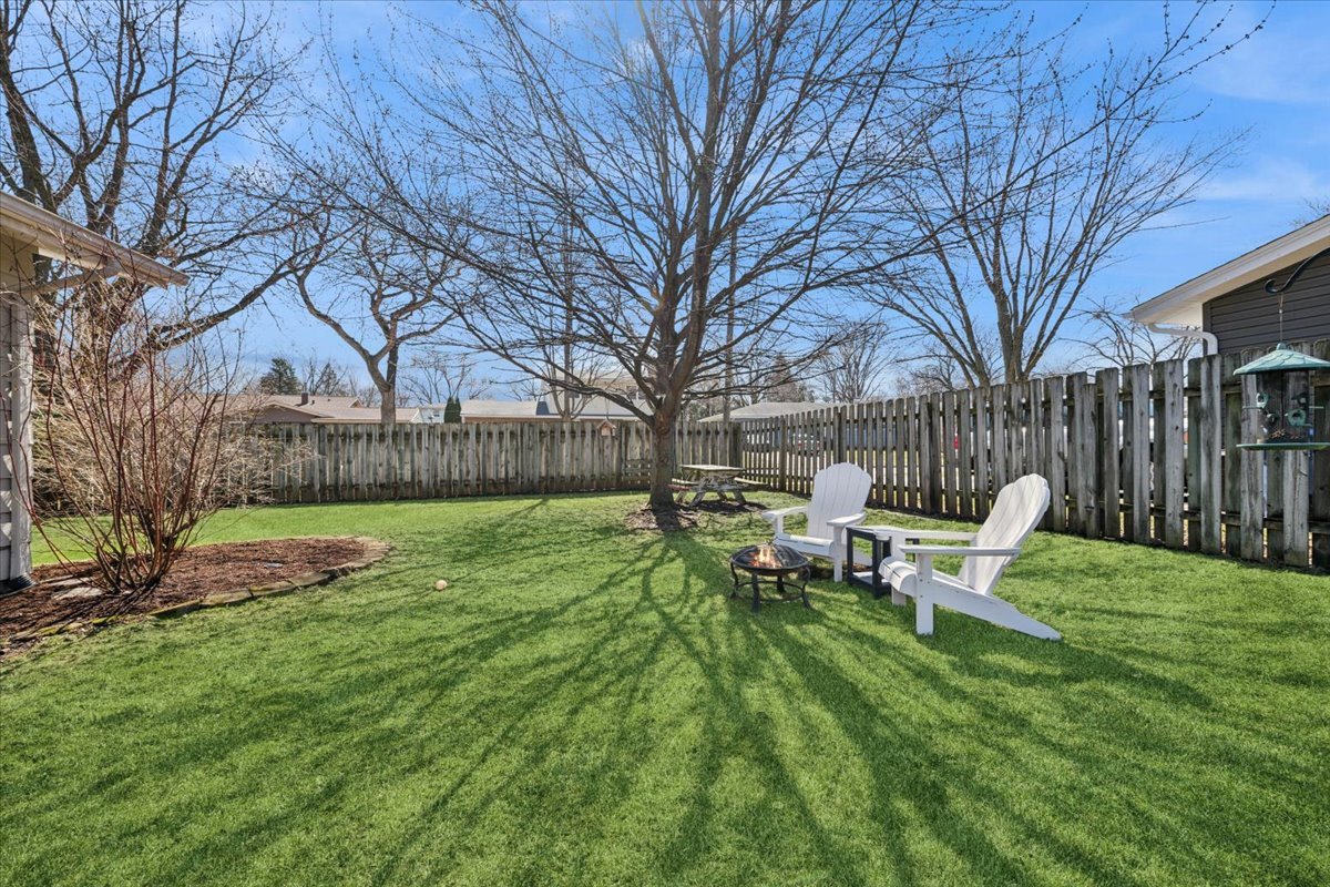 1702 Oak Street St. Charles, IL 60174 - Photo 20 of 20 a view of a bench in the backyard of house