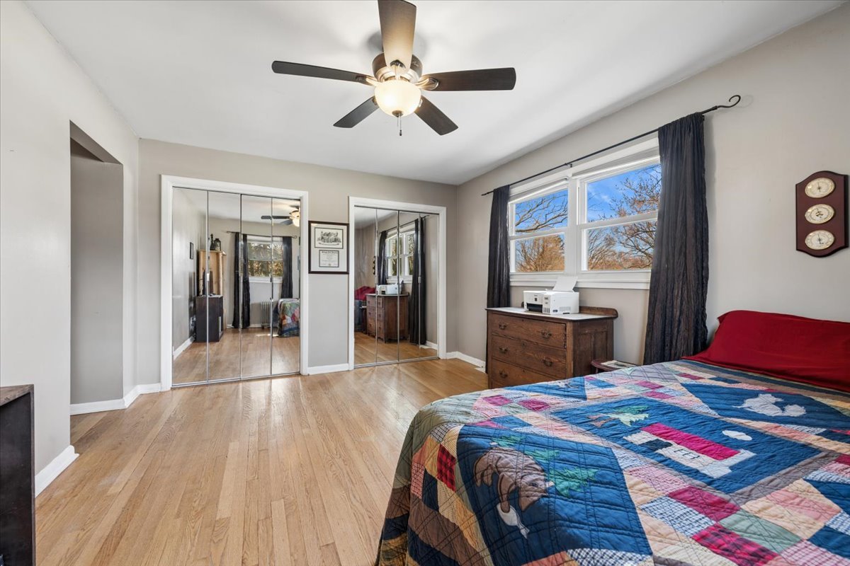 1702 Oak Street St. Charles, IL 60174 - Photo 9 of 20 a bedroom with a bed and a chandelier