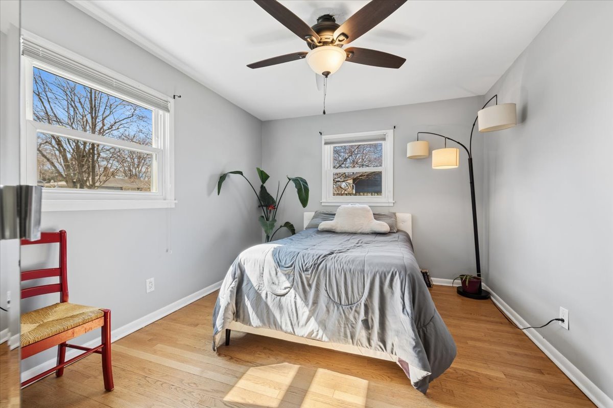 1702 Oak Street St. Charles, IL 60174 - Photo 10 of 20 a bedroom with a bed and a chandelier