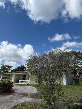 a house view with a garden space