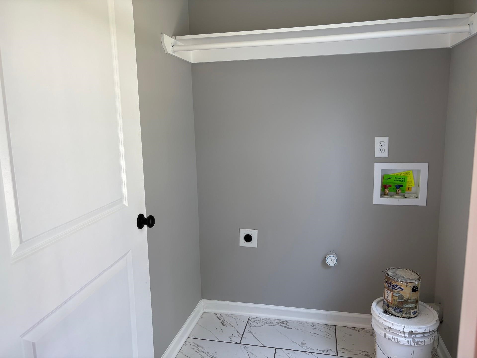 3701 Whittier Road Memphis, TN 38108 - Photo 11 of 13 Laundry area with electric dryer hookup, hookup for a washing machine, and light marble finish floors