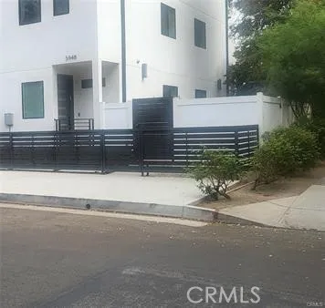 a view of a house with a street
