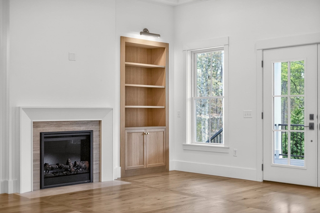 132 Great Western Road Harwich, MA 02645 - Photo 21 of 42 a view of a livingroom with a fireplace and window