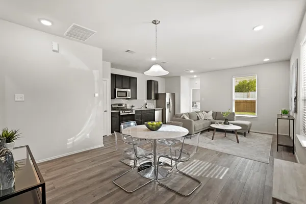 a view of a dining room with furniture window and wooden floor