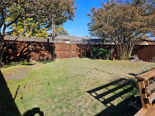 a view of a backyard of the house
