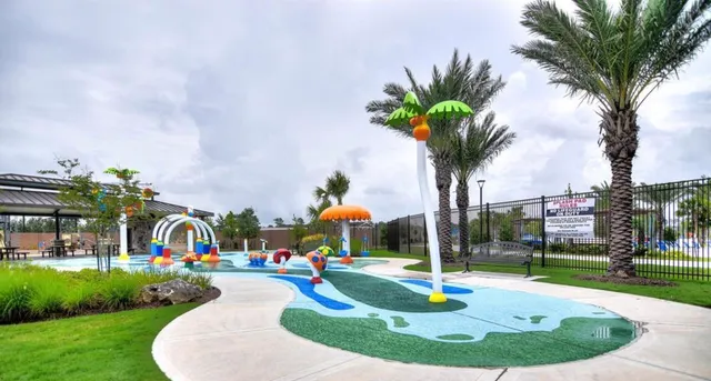 a swimming pool with outdoor seating yard and barbeque oven