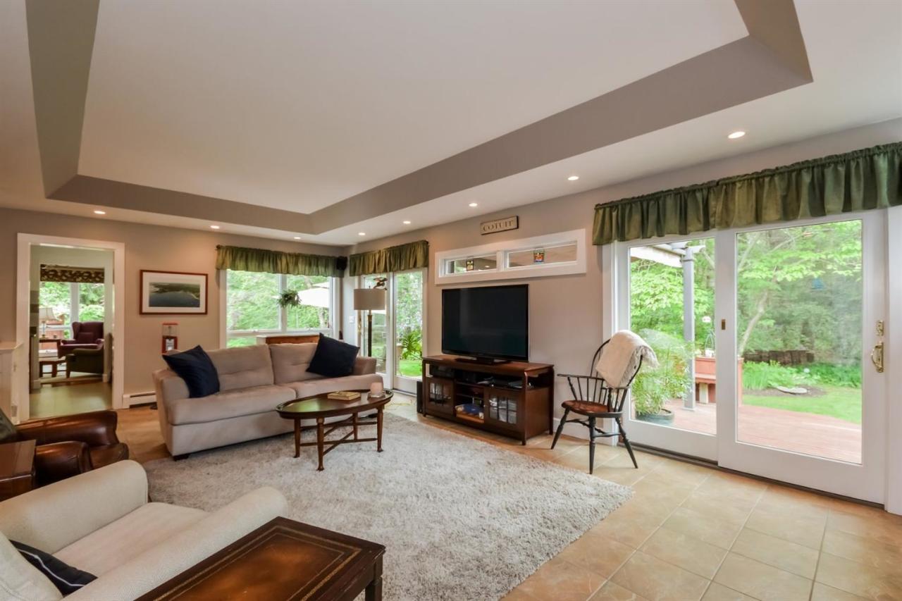 43 Poponessett Road Cotuit, MA 02635 - Photo 14 of 31 a living room with furniture and a flat screen tv