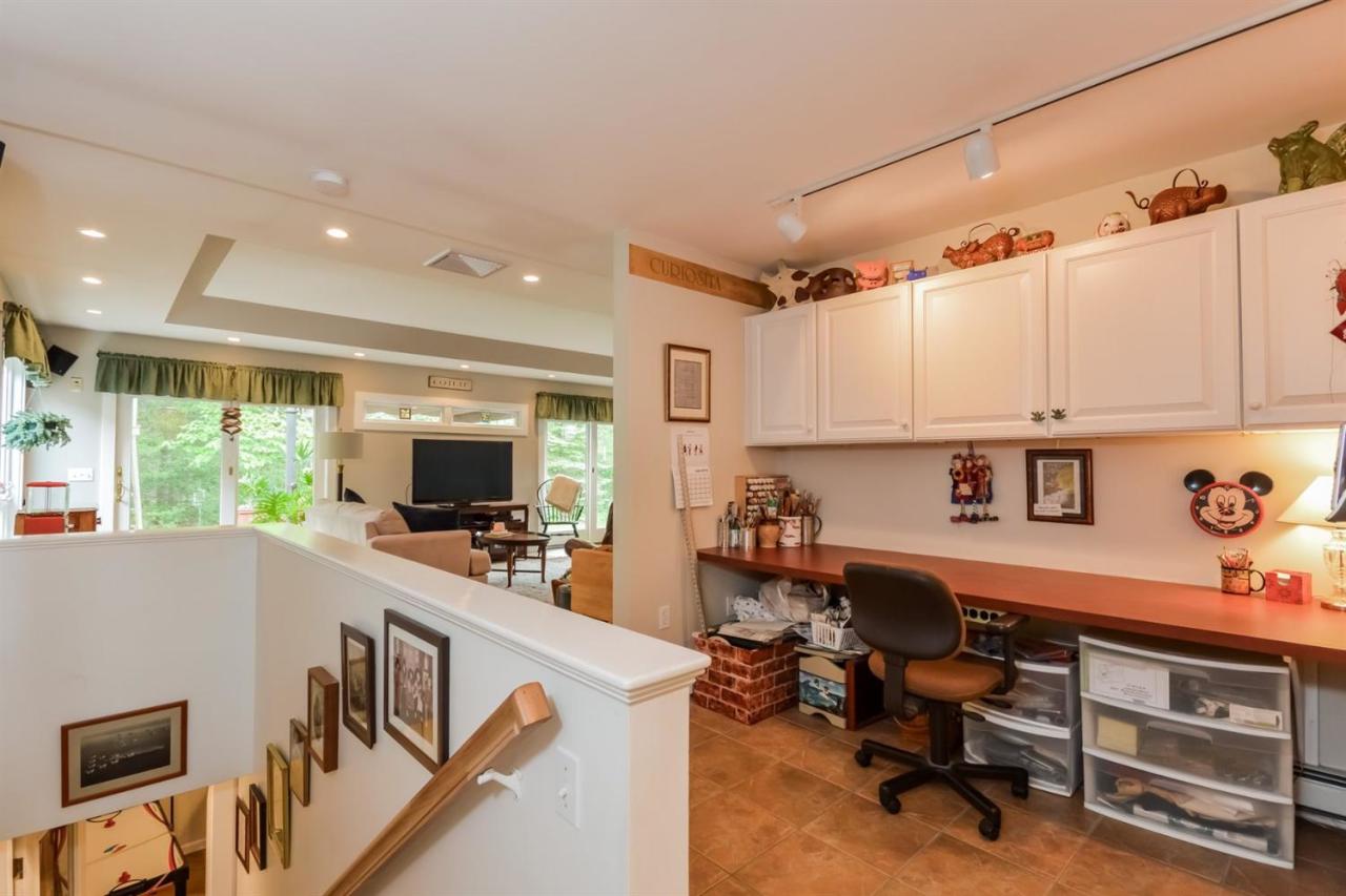 43 Poponessett Road Cotuit, MA 02635 - Photo 16 of 31 a view of a workspace with furniture and a window