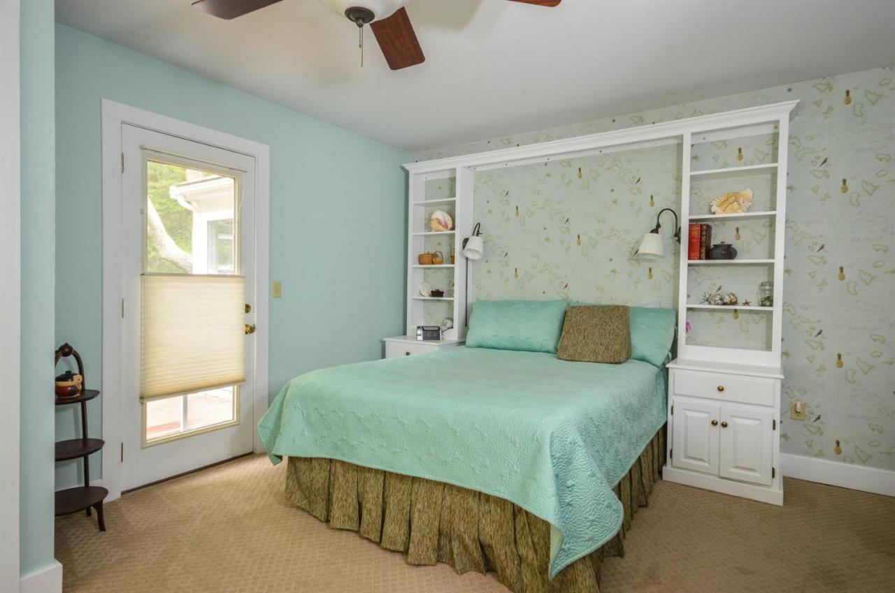 43 Poponessett Road Cotuit, MA 02635 - Photo 18 of 31 a bedroom with a bed and a window