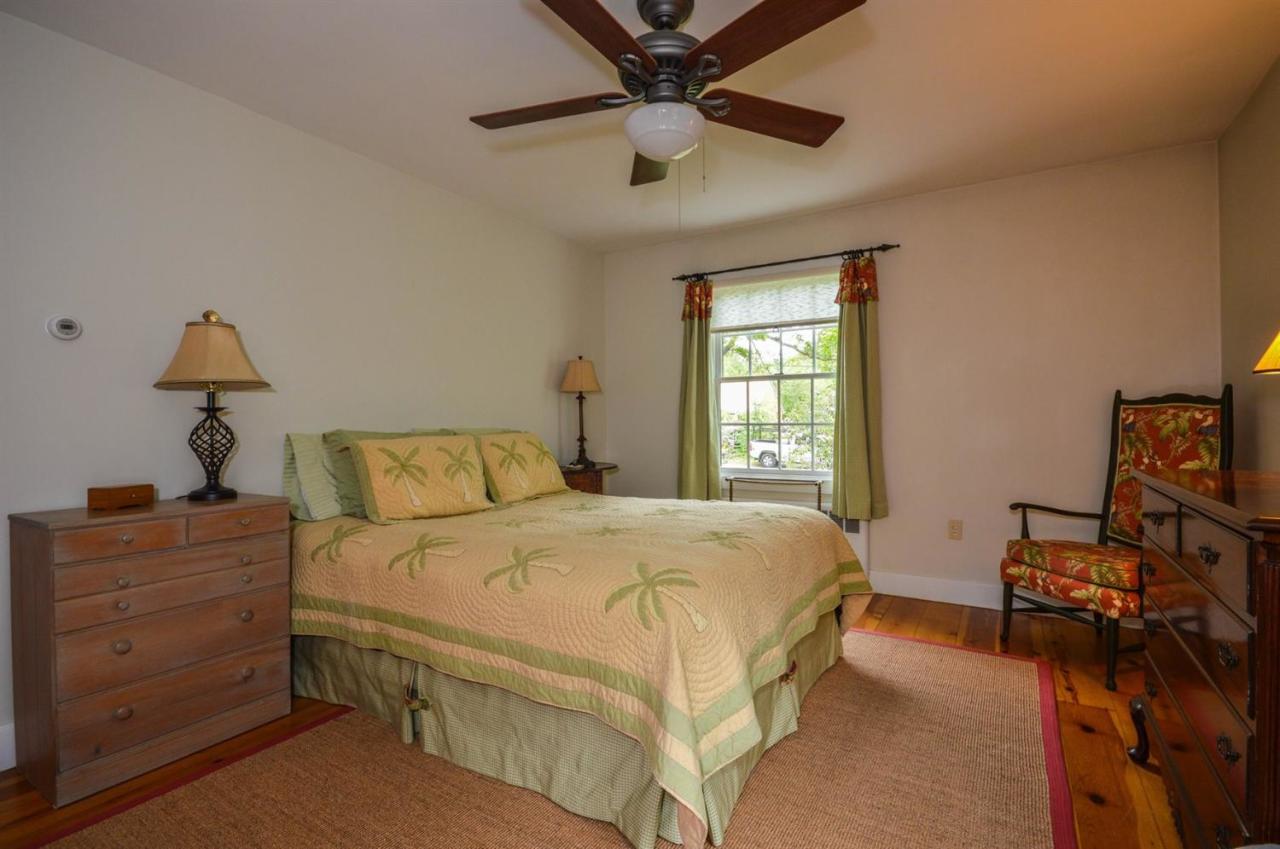 43 Poponessett Road Cotuit, MA 02635 - Photo 19 of 31 a bedroom with a bed and a window