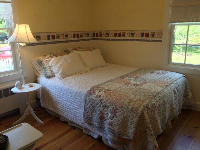 43 Poponessett Road Cotuit, MA 02635 - Photo 20 of 31 a bed sitting in a bedroom next to a window