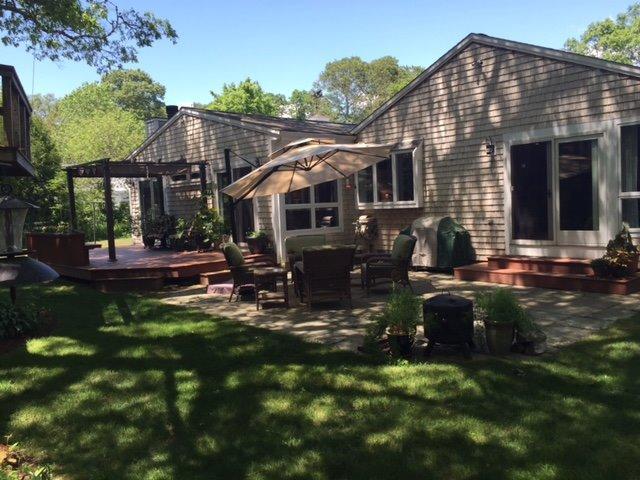 43 Poponessett Road Cotuit, MA 02635 - Photo 3 of 31 a view of a house with a yard