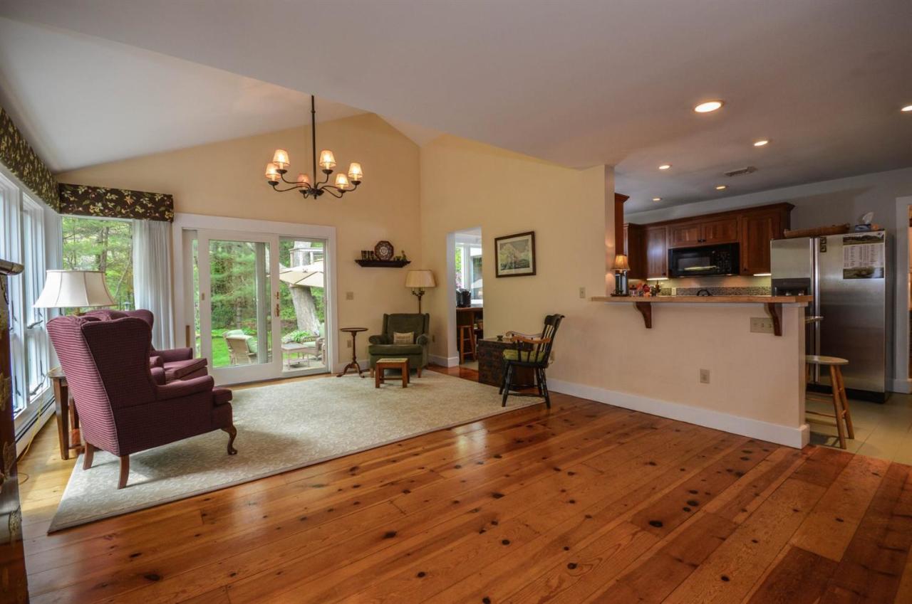43 Poponessett Road Cotuit, MA 02635 - Photo 6 of 31 a view of a dining room with furniture window and outside view