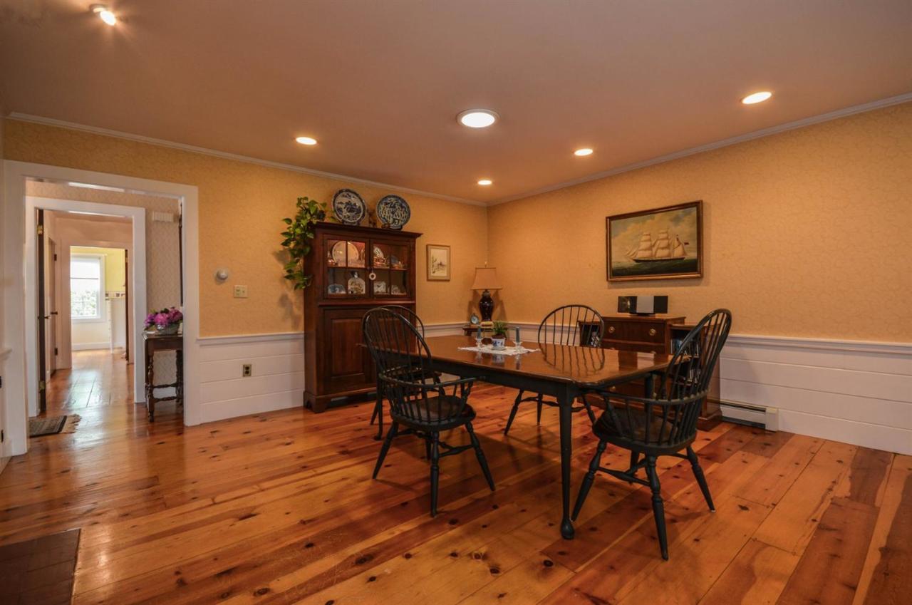 43 Poponessett Road Cotuit, MA 02635 - Photo 8 of 31 a view of a dining room with furniture