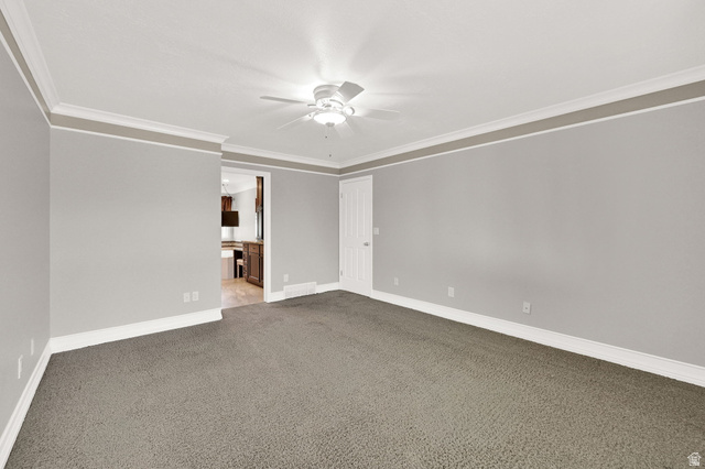 4792 Glasmann Way South Ogden, UT 84403 - Photo 32 of 70 Spacious primary suite bedroom featuring neutral grey walls and contrasting white crown molding