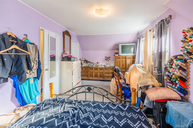 a view of a bedroom with furniture and toys