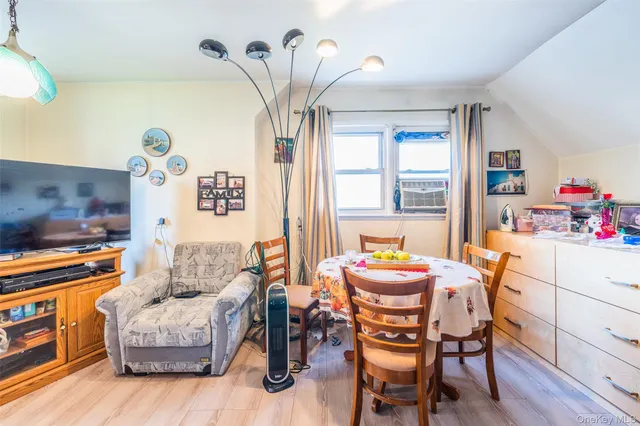 a dining room with furniture and window