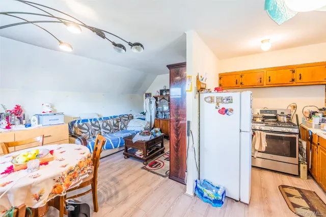 a storage room with furniture and a flat screen tv