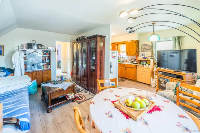 a living room with furniture and flat screen tv