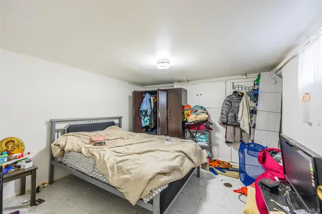 a bed room with a bed and a desk