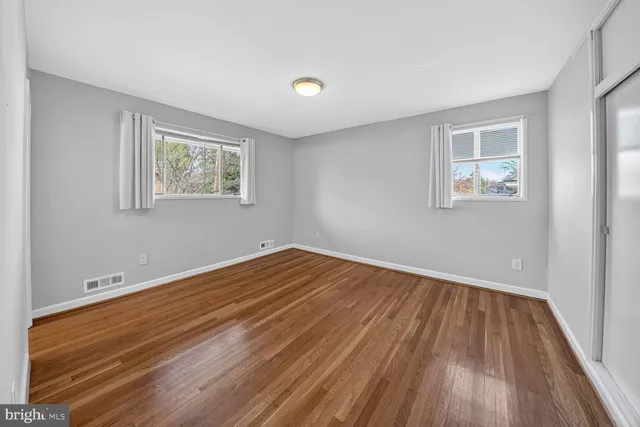 a view of room with wooden floor and window