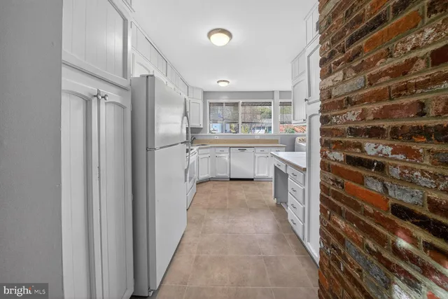 a bathroom with a double vanity sink and mirror