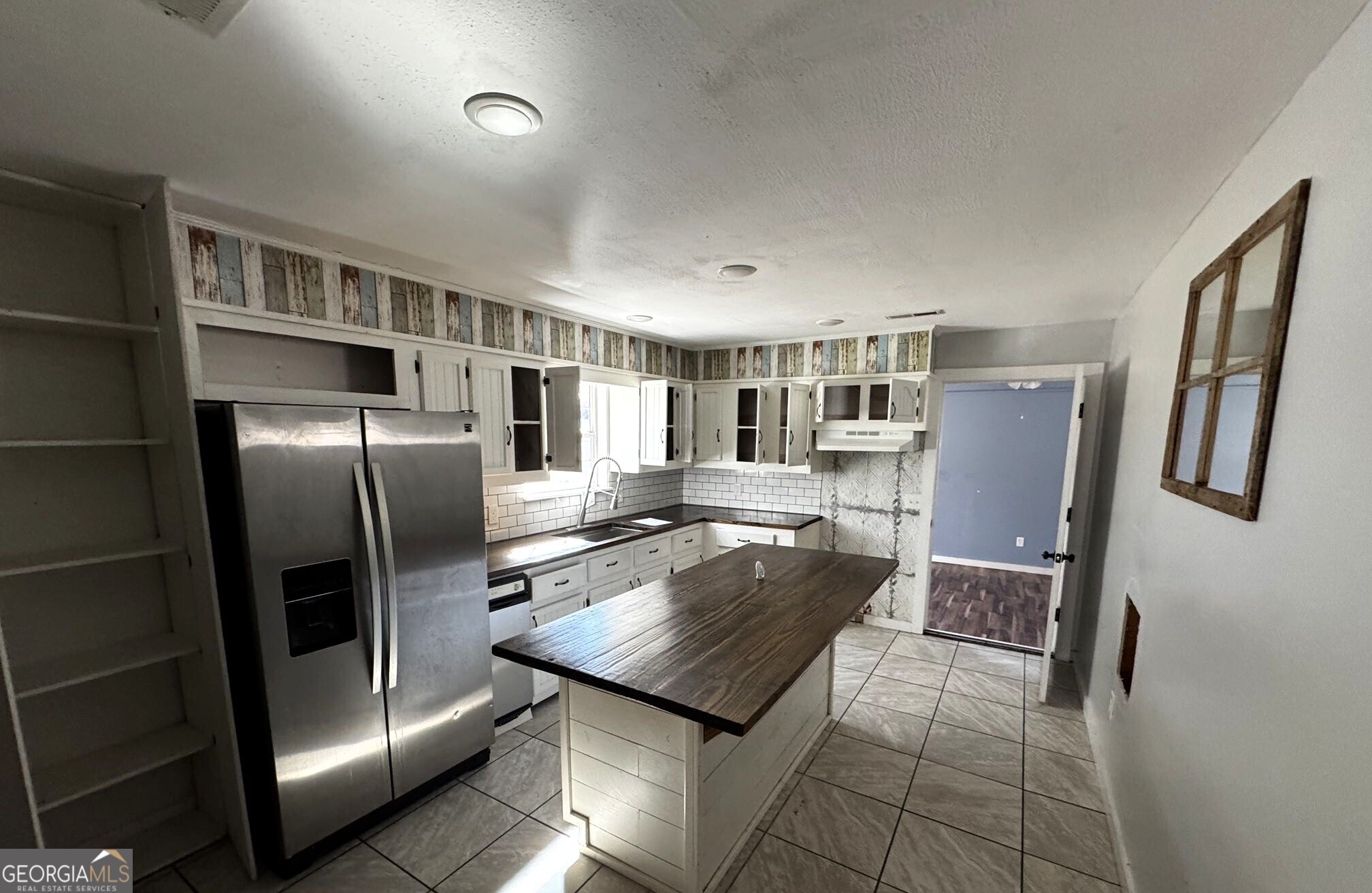 1614 Kendall Road Rocky Face, GA 30740 - Photo 3 of 10 a kitchen with stainless steel appliances granite countertop a refrigerator a stove and a sink