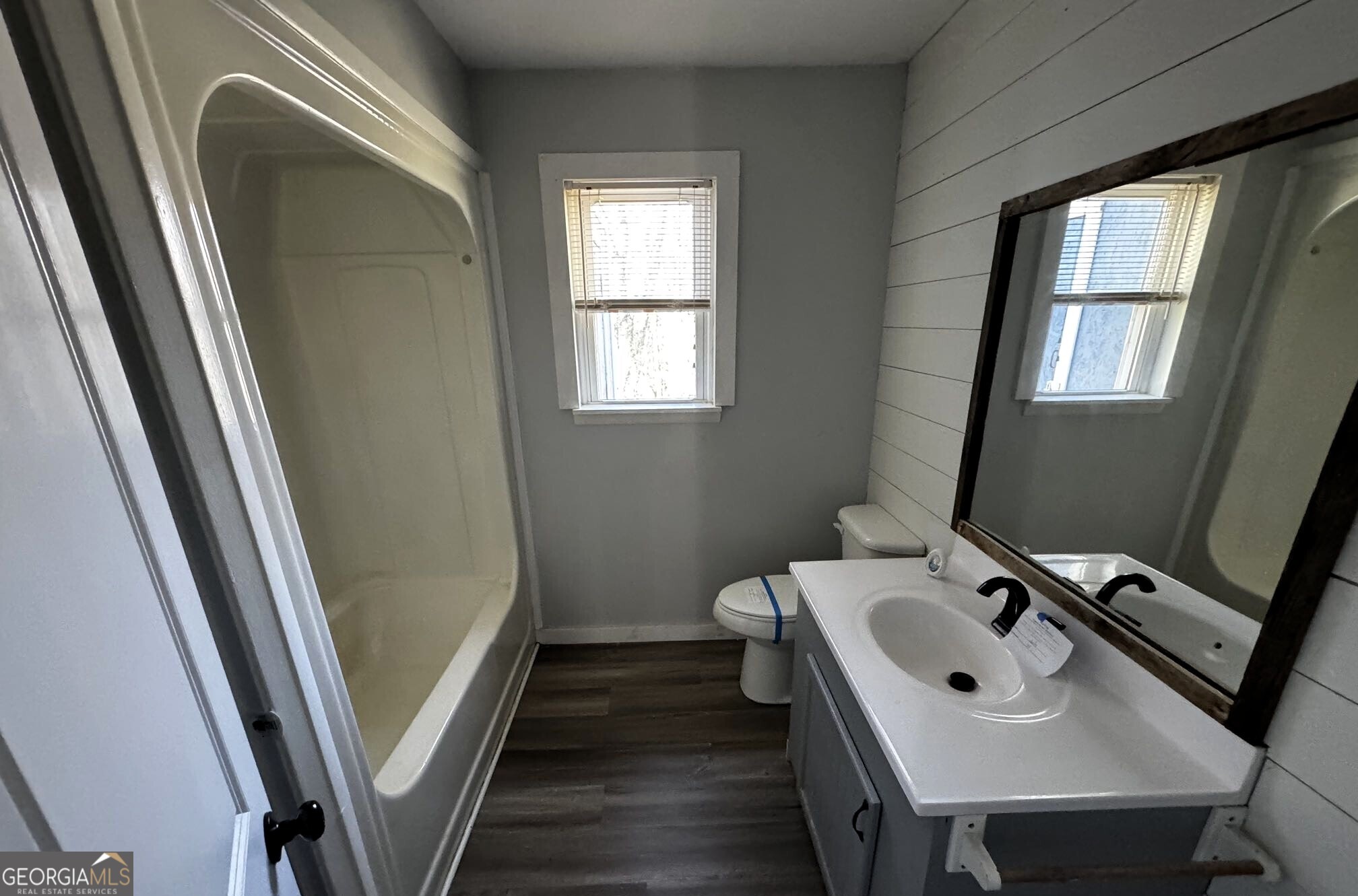 1614 Kendall Road Rocky Face, GA 30740 - Photo 5 of 10 a bathroom with a sink a mirror and a window