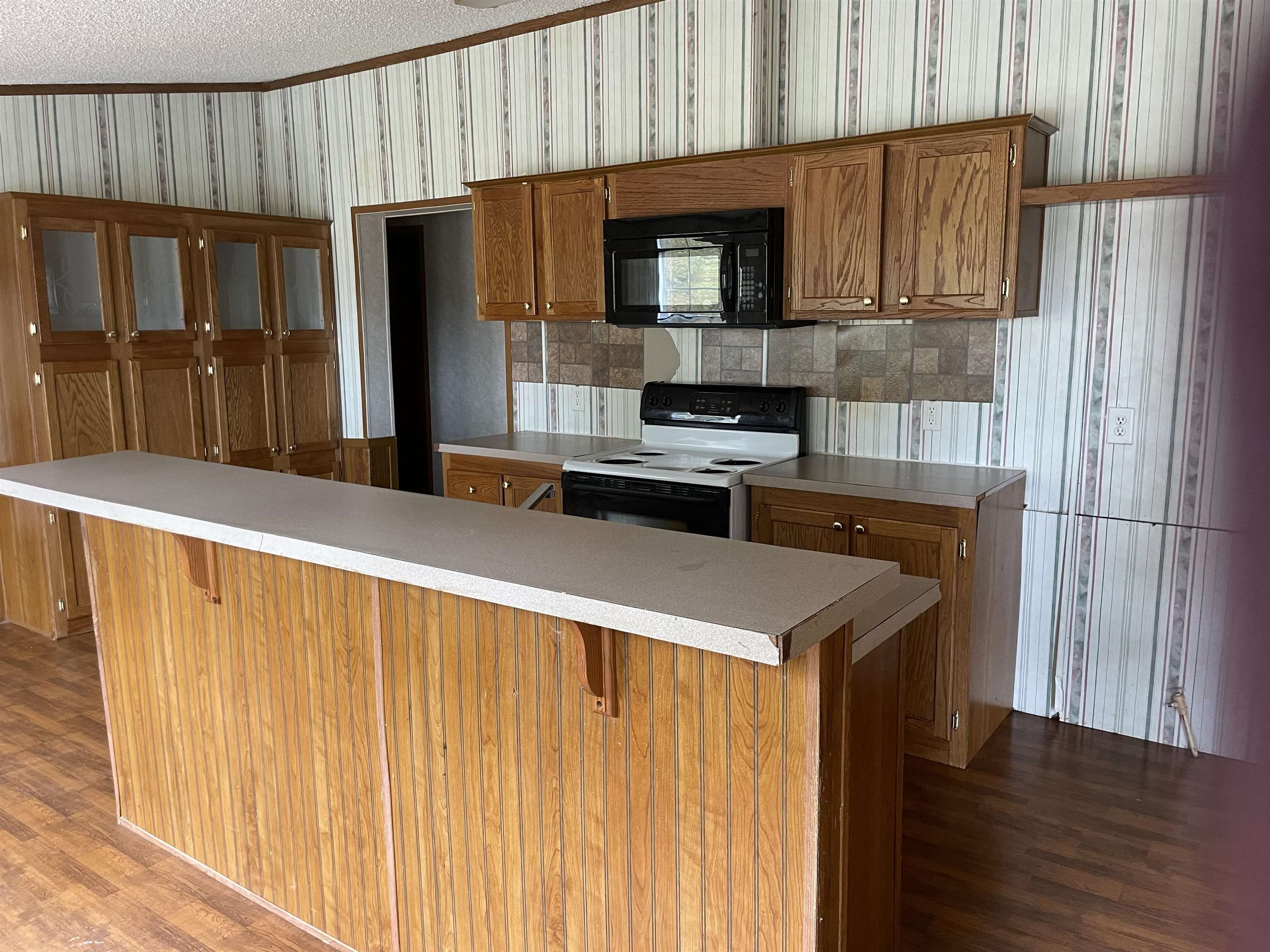 709 Robertson Road Mason, TN 38049 - Photo 4 of 16 a kitchen with stainless steel appliances a refrigerator and a microwave