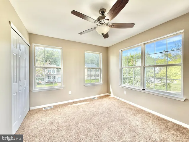 a view of a room with wooden walls