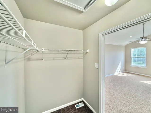 a view of a house with a yard and garage