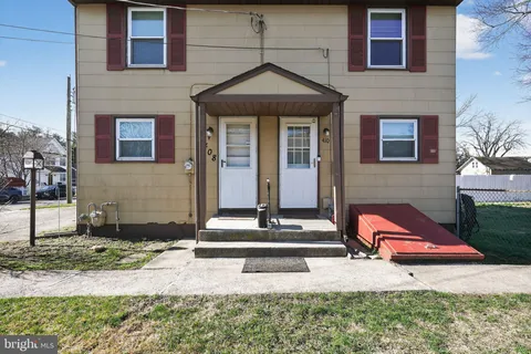 a front view of a house with garage
