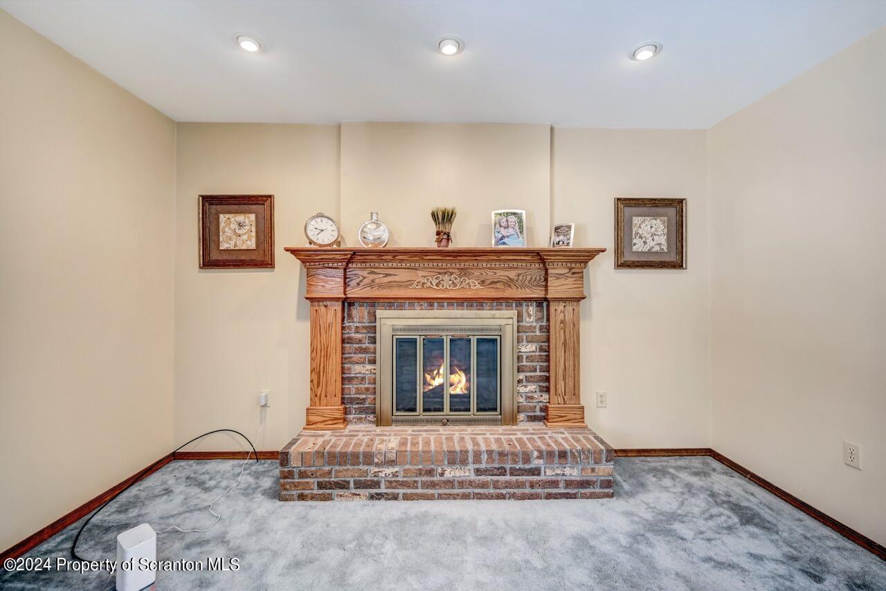 820 Forest Road Lake Ariel, PA 18436 - Photo 8 of 58 a living room with furniture and a fireplace