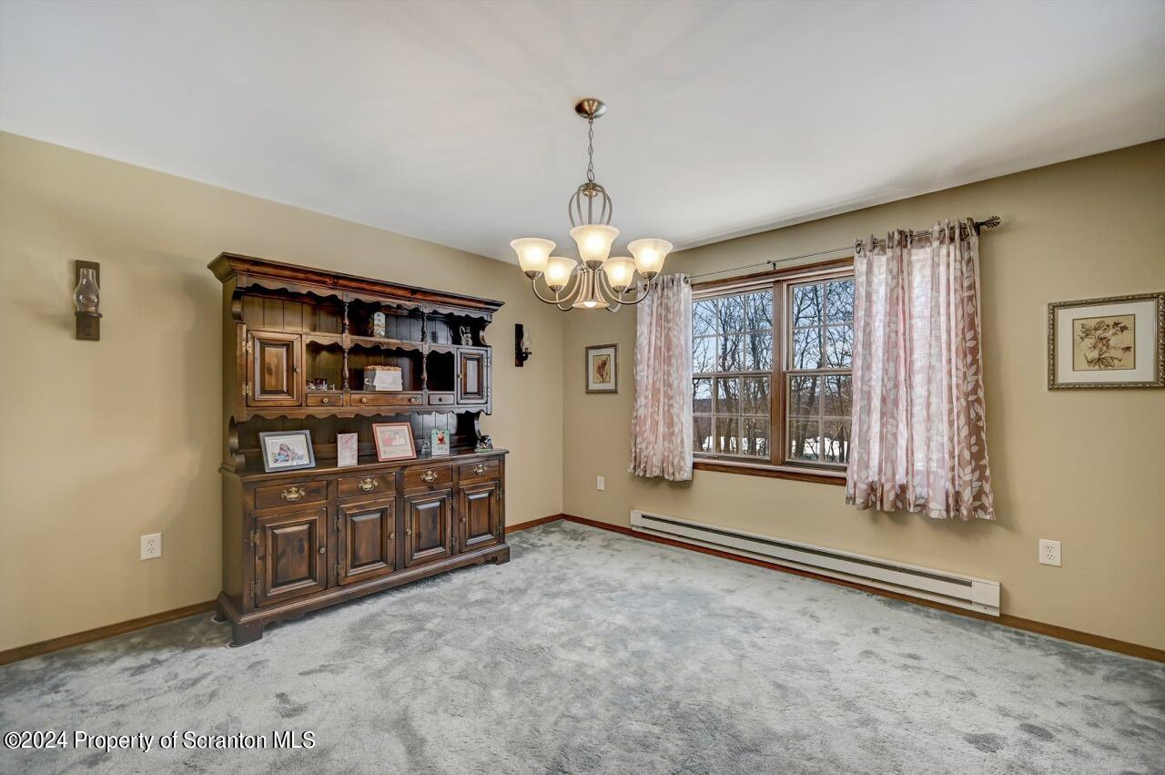 820 Forest Road Lake Ariel, PA 18436 - Photo 10 of 58 a view of an empty room with cabinet and a window