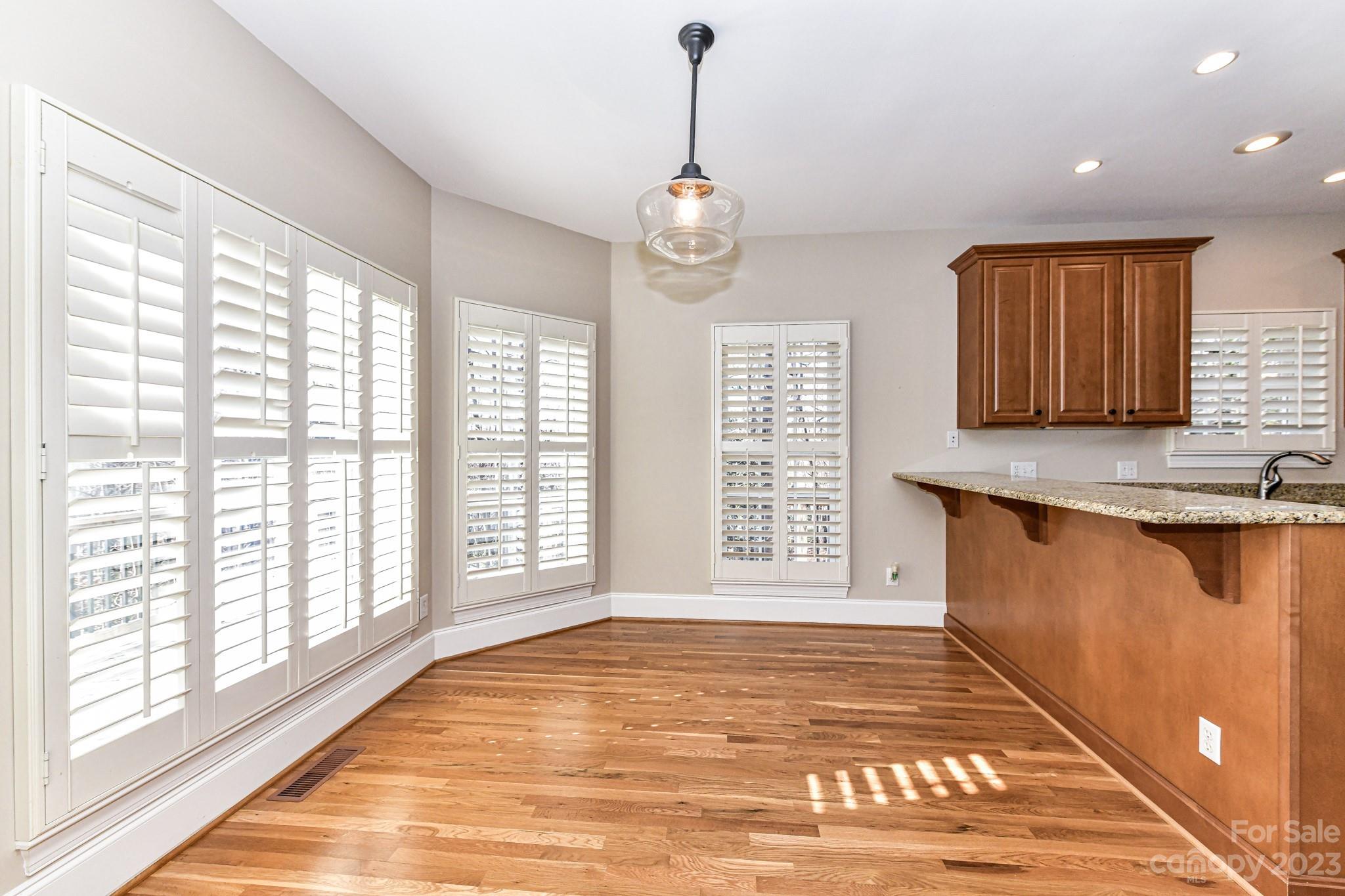 151 Maple View Drive Troutman, NC 28166 - Photo 13 of 43 a view of an empty room with window and kitchen area
