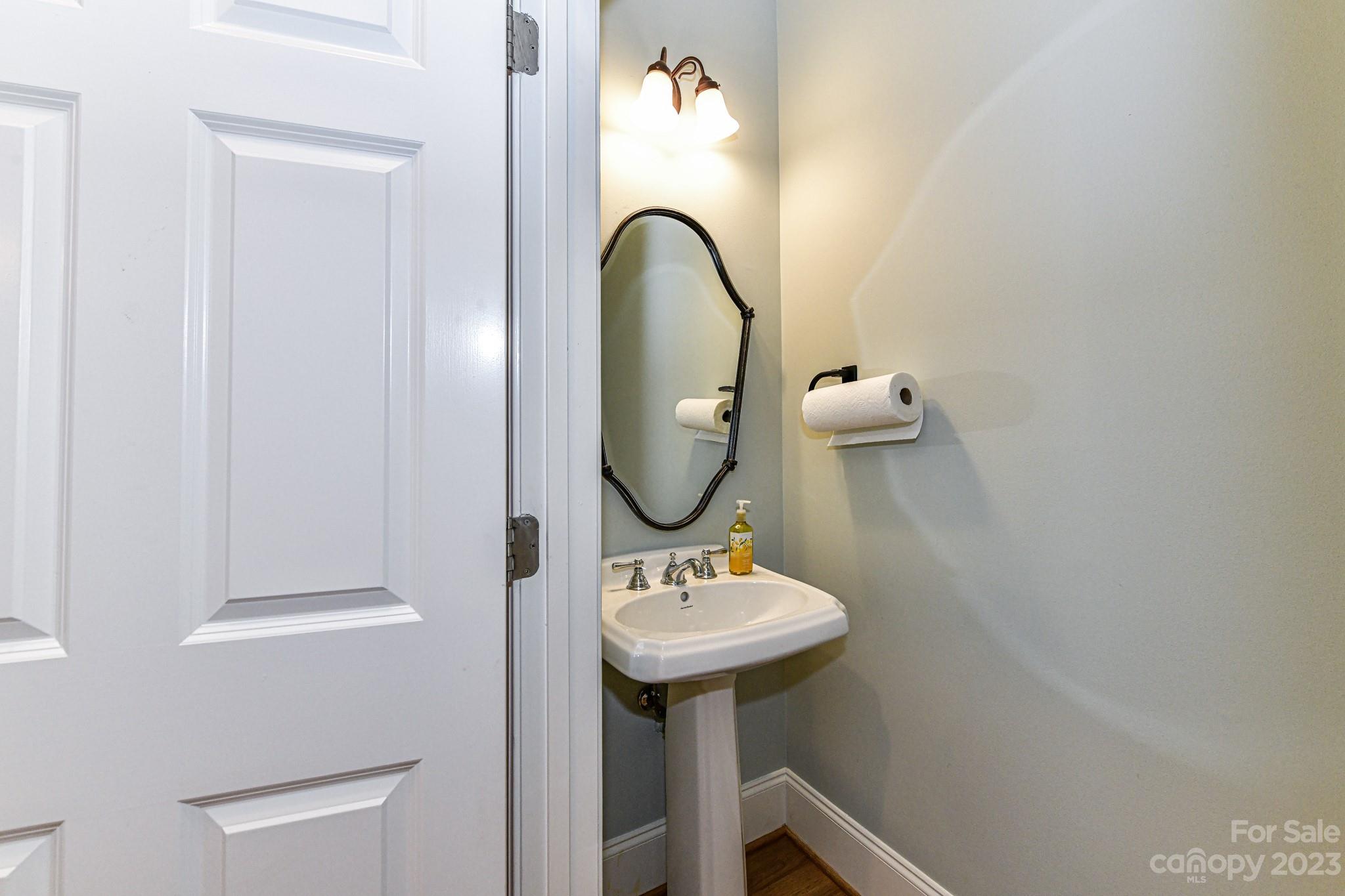 151 Maple View Drive Troutman, NC 28166 - Photo 14 of 43 a bathroom with a sink and a mirror