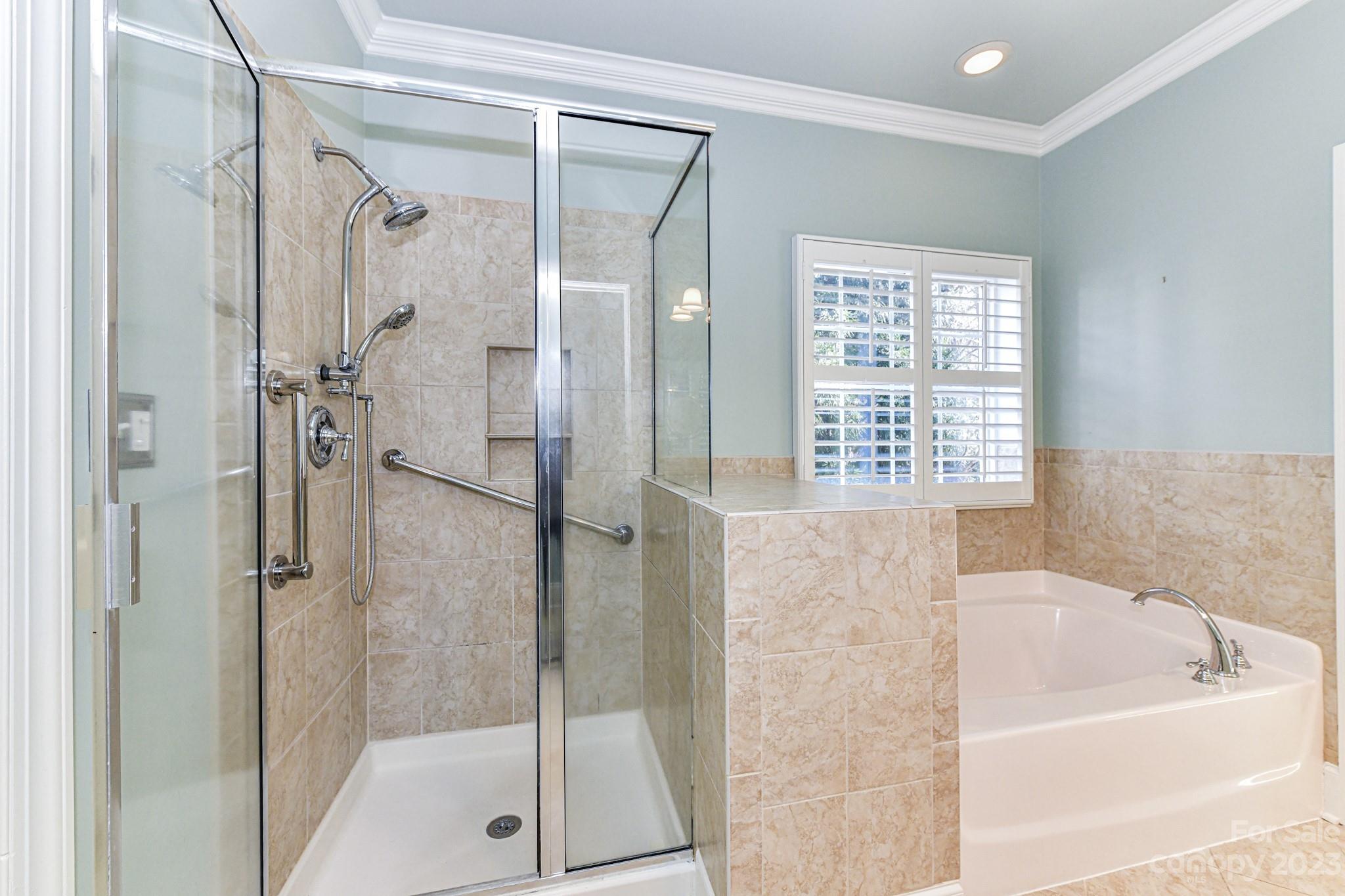 151 Maple View Drive Troutman, NC 28166 - Photo 18 of 43 a bathroom with a bathtub and a shower