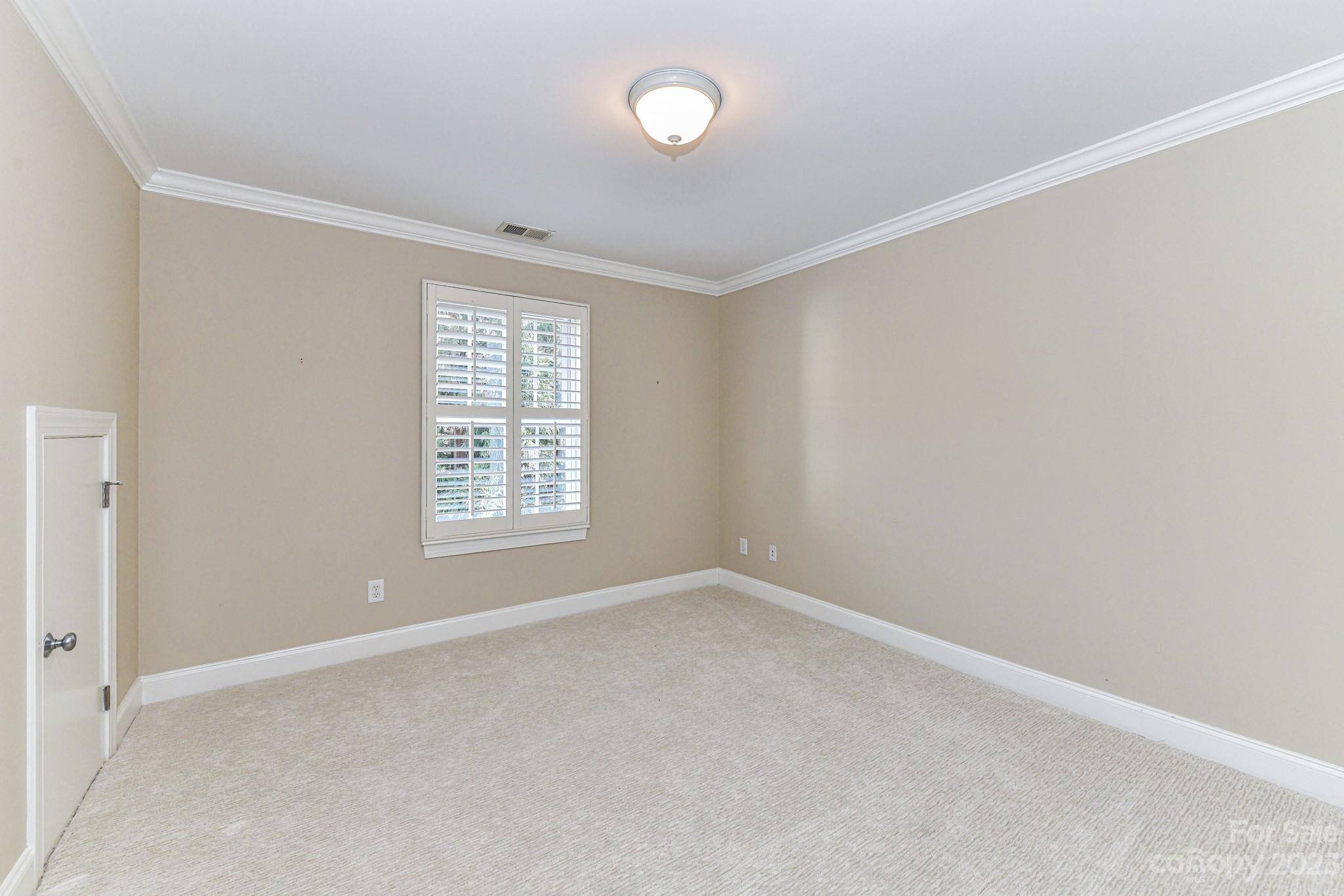 151 Maple View Drive Troutman, NC 28166 - Photo 26 of 43 a view of an empty room with a window