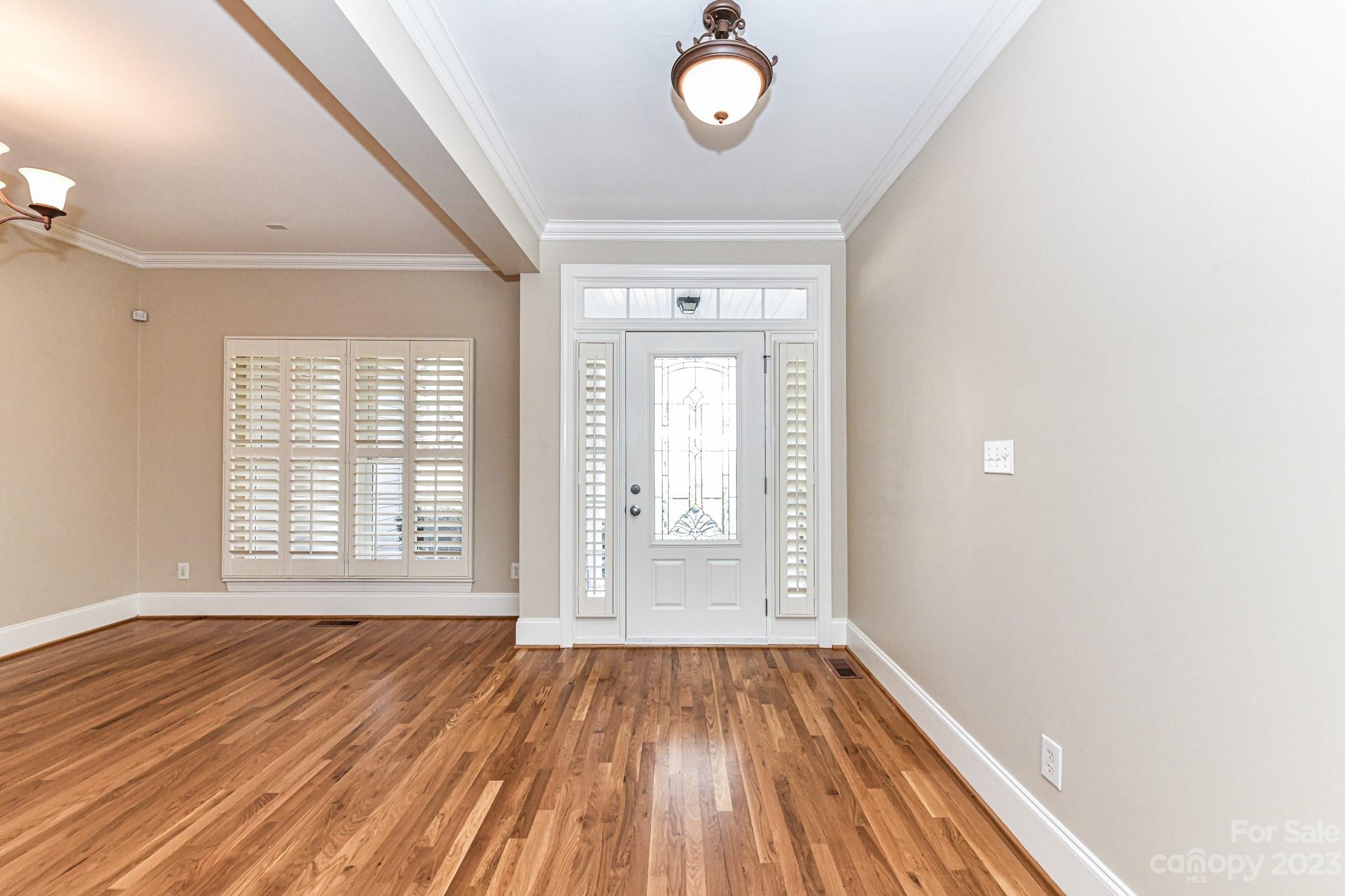 151 Maple View Drive Troutman, NC 28166 - Photo 5 of 43 an empty room with wooden floor and windows