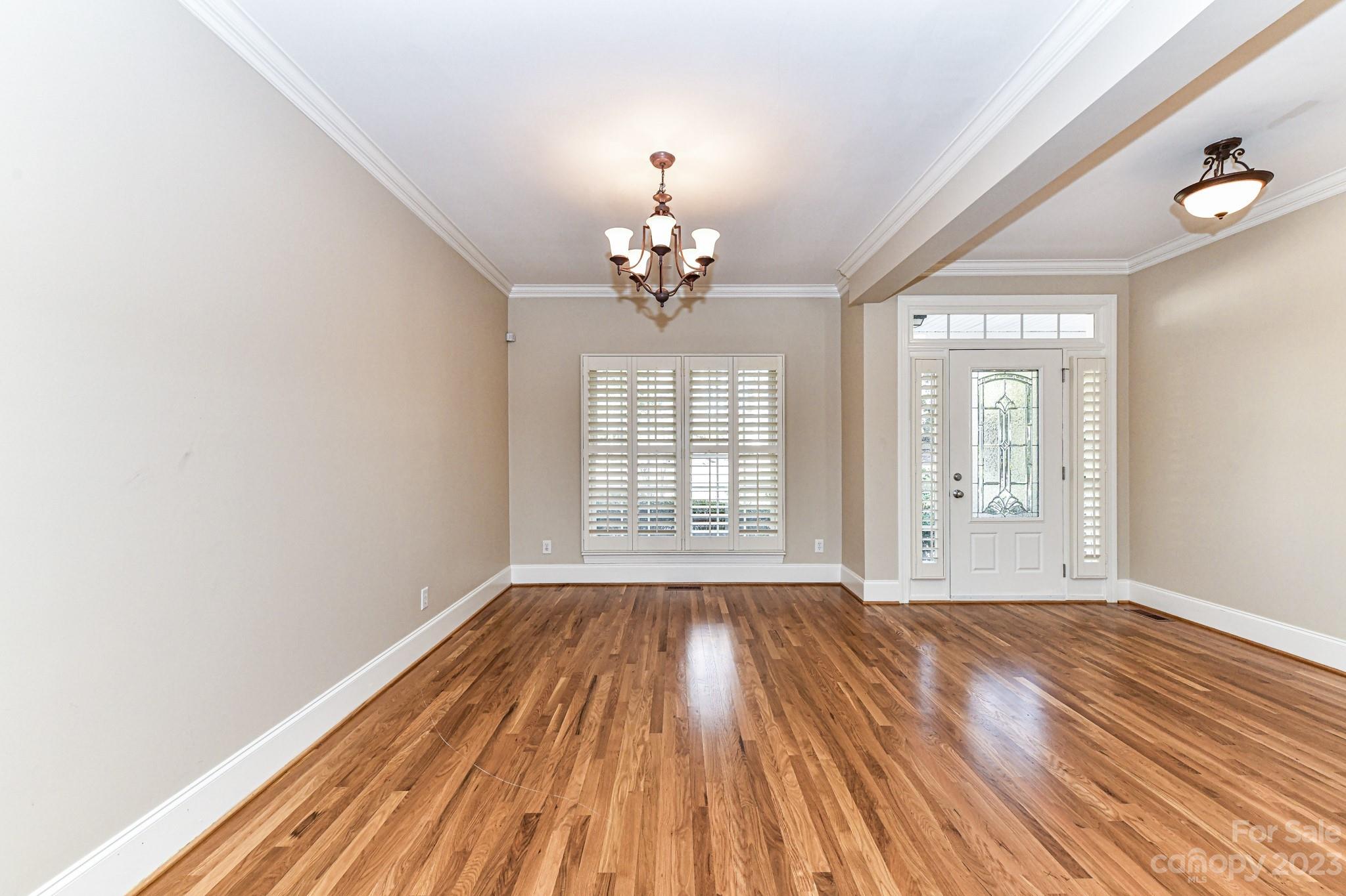 151 Maple View Drive Troutman, NC 28166 - Photo 6 of 43 a view of an empty room with wooden floor and a window