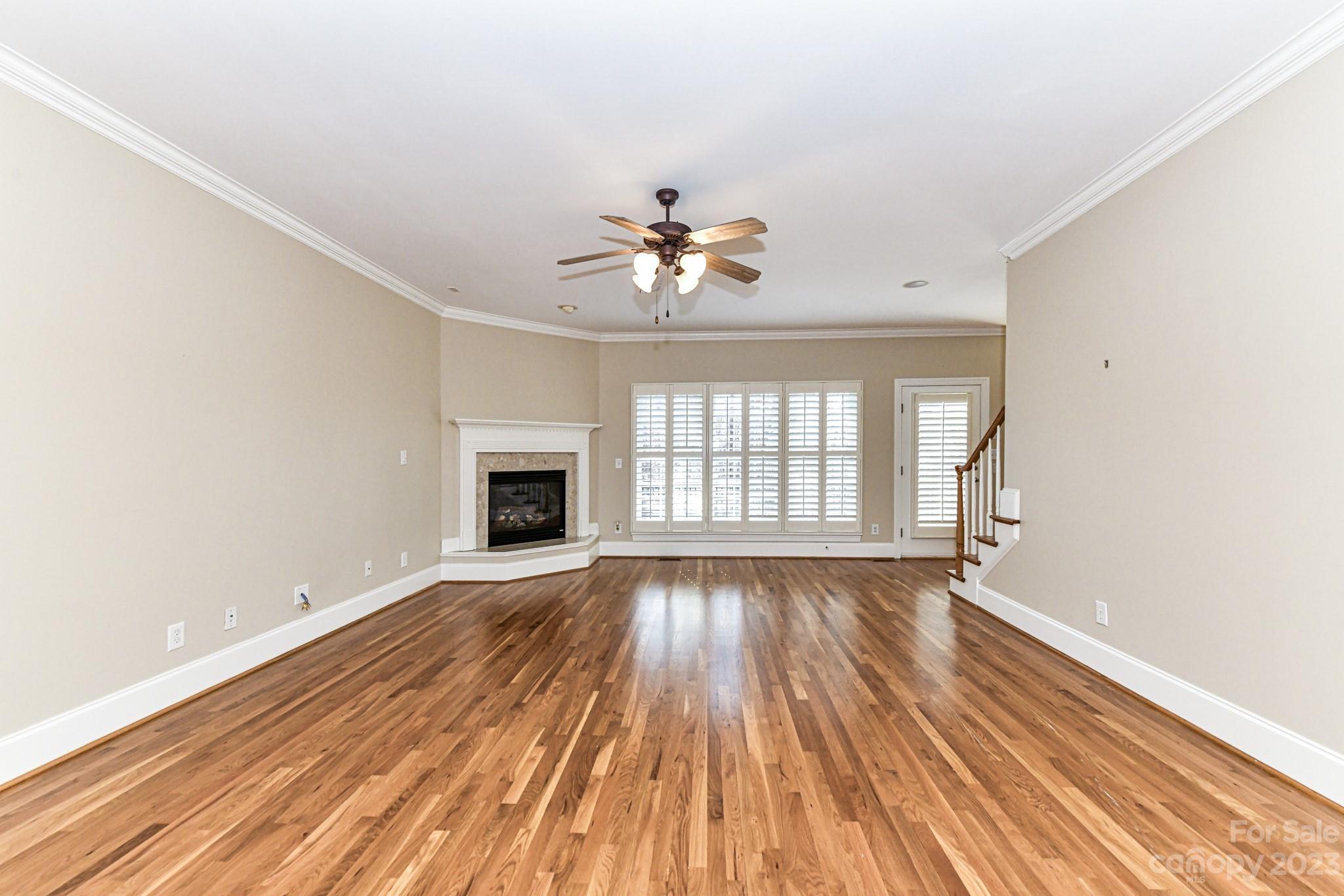 151 Maple View Drive Troutman, NC 28166 - Photo 7 of 43 a view of an empty room with wooden floor and a window