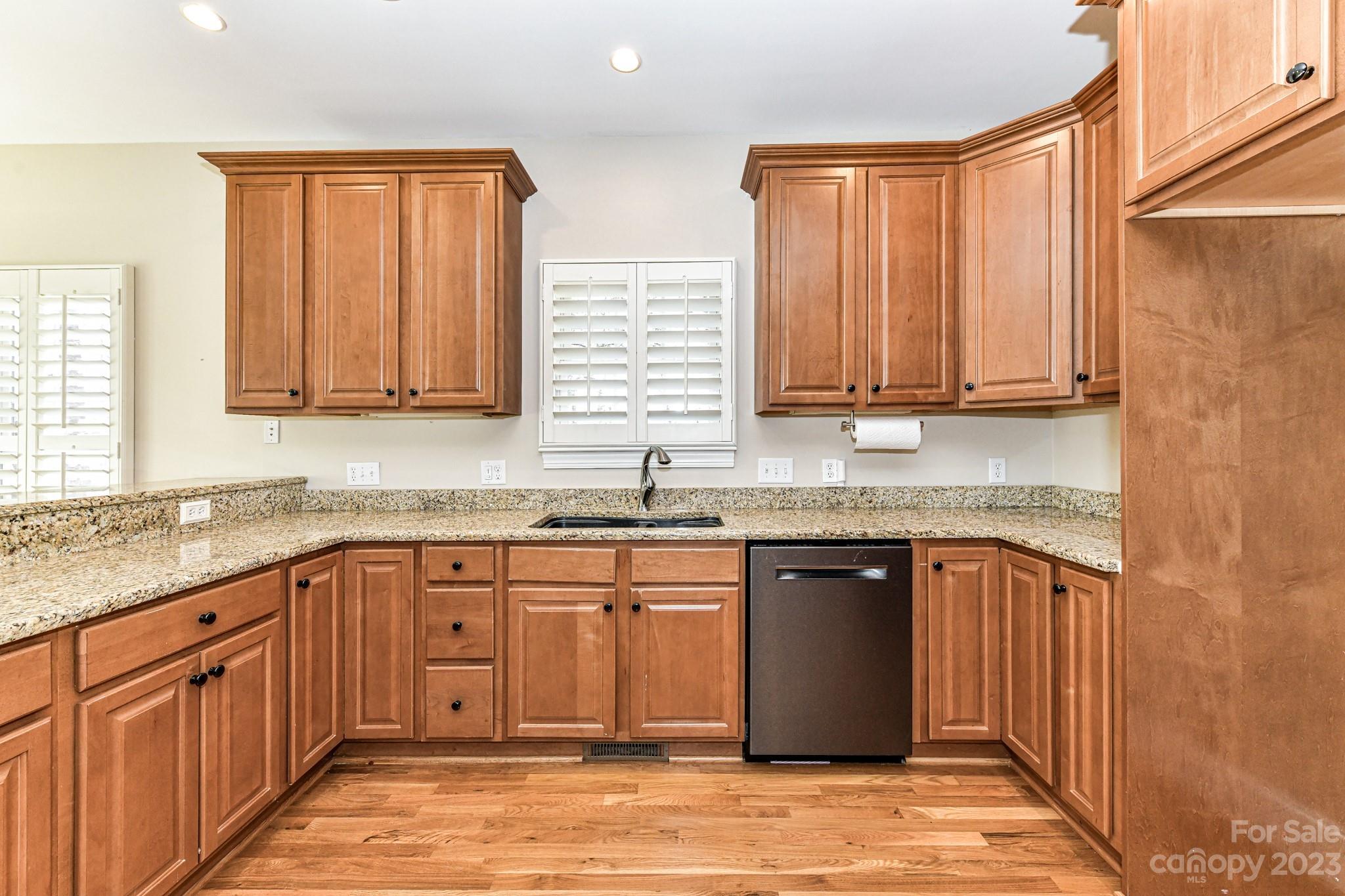 151 Maple View Drive Troutman, NC 28166 - Photo 10 of 43 a kitchen with stainless steel appliances granite countertop a sink stove and cabinets
